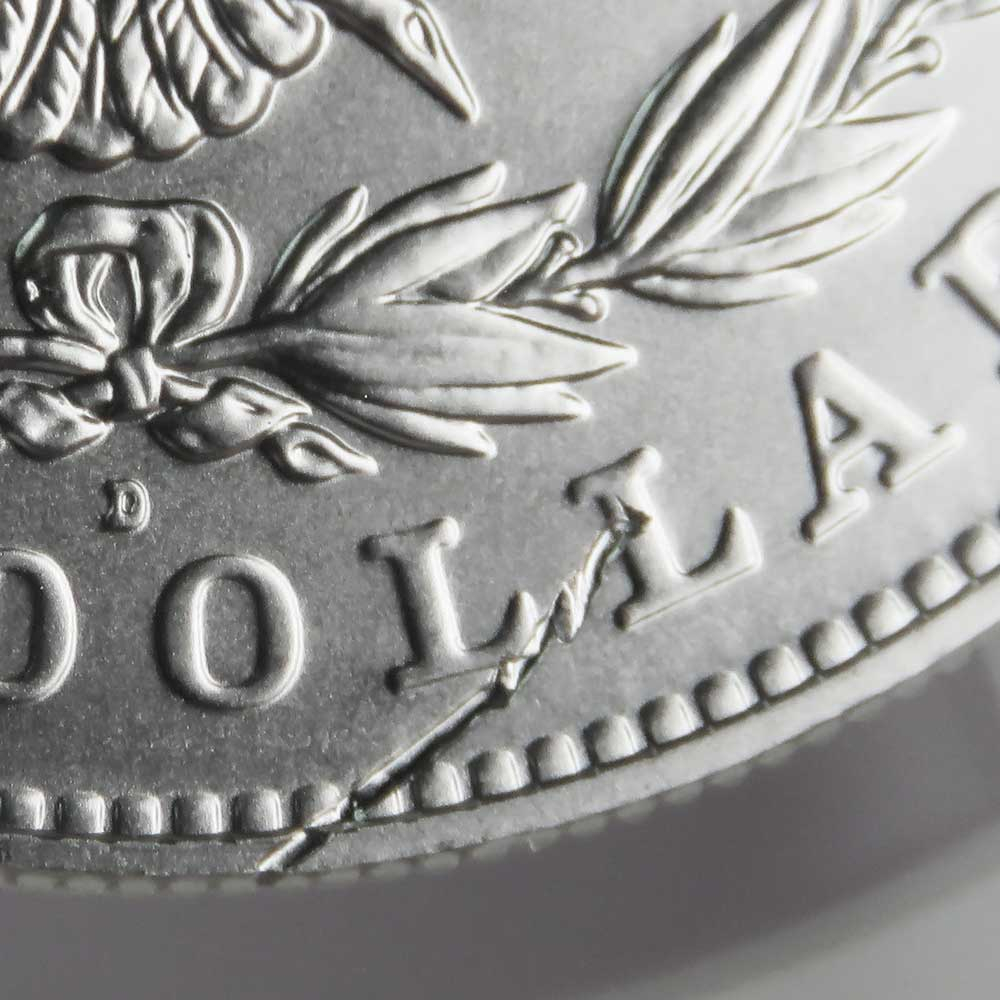 Silver dollar with a strike-through error