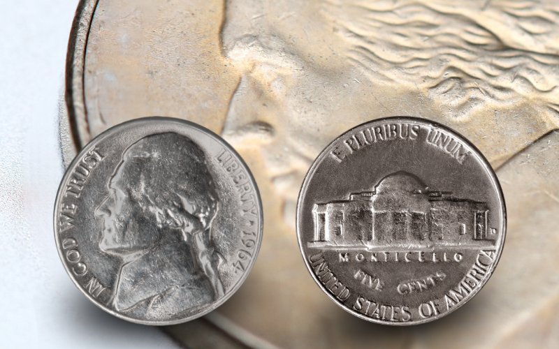 Front and back of a Jefferson Nickel minted in 1964 with a background image of a close up of the front of a nickel